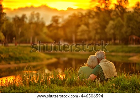 mature couple   in summer park Royalty-Free Stock Photo #446506594