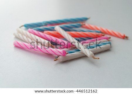 Birthday candles on white background, selective focus and soft focus