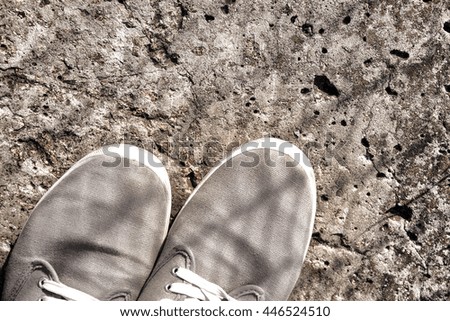 Men's sneakers on a concrete background. Shoes close up.