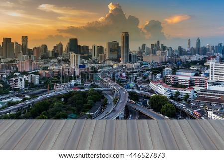 Opening wooden floor, Twilight sky background, city and highway intersection night view.