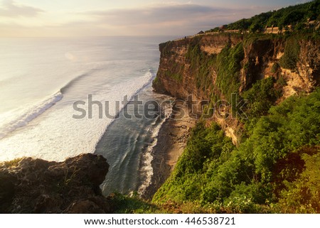 View from the cliffs of the ocean at sunset . Uluwatu Temple , Bali