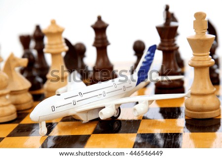Closeup of toy plane on chessboard