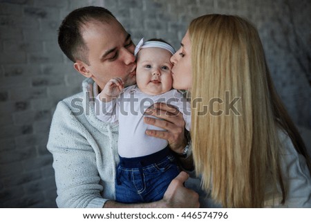 happy father and mother with baby