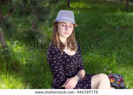 Portrait of  woman on green background. Pretty girl at outdoors on summer day. Nature environment background.