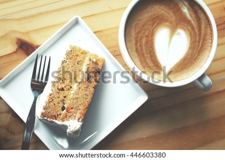 Carrot cake with coffee cup Royalty-Free Stock Photo #446603380