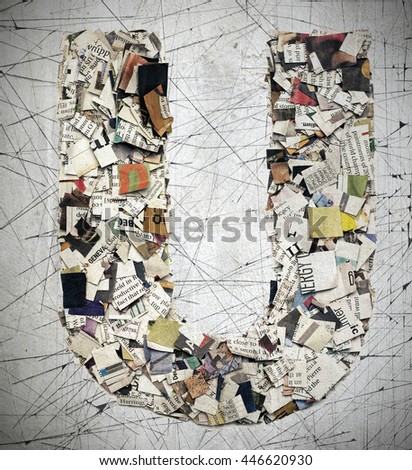 The letter  U  made from newspaper confetti