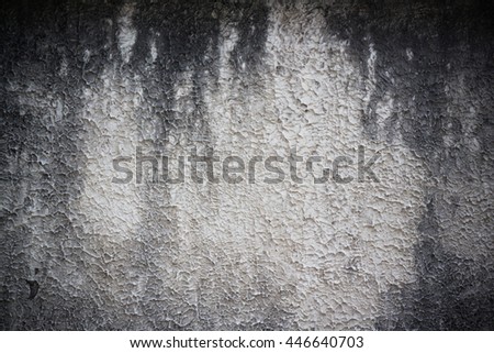 grungy concrete wall with dark vignette 