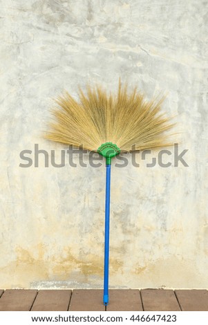 broom on concreate background