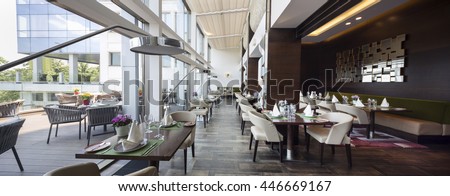 Modern restaurant interior, part of a hotel

 Royalty-Free Stock Photo #446669167