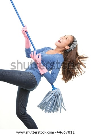 Cleaning woman having fun by playing air guitar with the mop. Isolated on white background. Royalty-Free Stock Photo #44667811