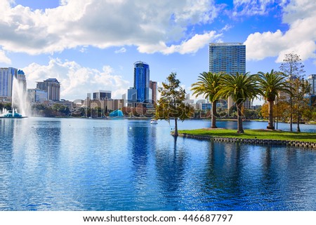 Orlando skyline fom lake Eola in Florida USA with palm trees Royalty-Free Stock Photo #446687797
