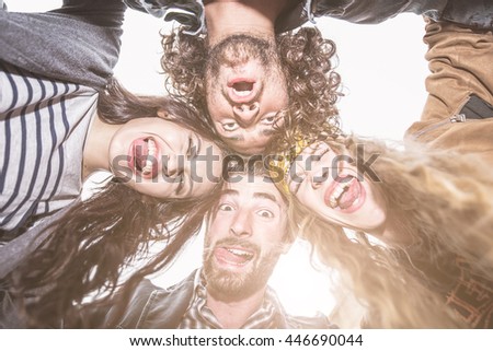 Group of friends making funny faces at camera