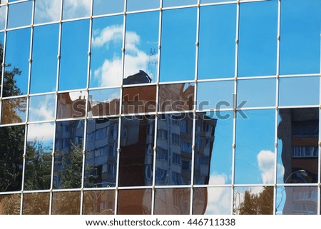 glass office building reflection sky cloud