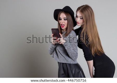 beautiful funny naughty girlfriend relieve themselves on the phone having fun fooling around in the studio
