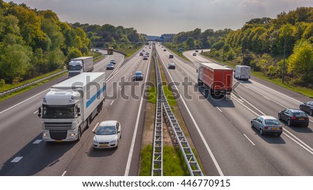 Evening motor Traffic on the A12 Motorway seen from above. One of the Bussiest highways in the Netherlands Royalty-Free Stock Photo #446770915
