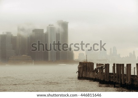 New York City downtown business district with pier in a foggy day