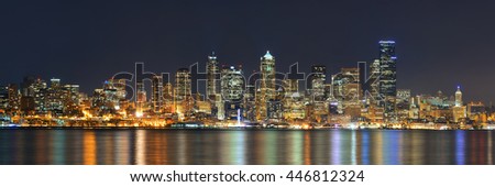 Seattle city skyline view over sea with urban architecture.