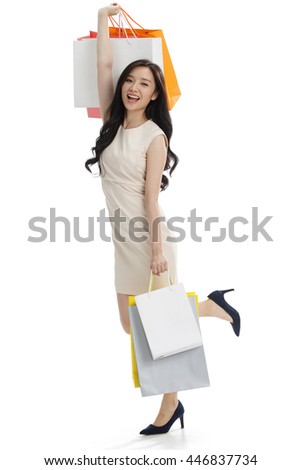 A young girl with a shopping bag