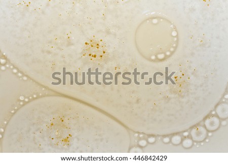 oil bubbles float over a blurred background