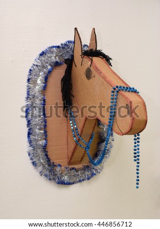 The horse's head made of cardboard packaging
