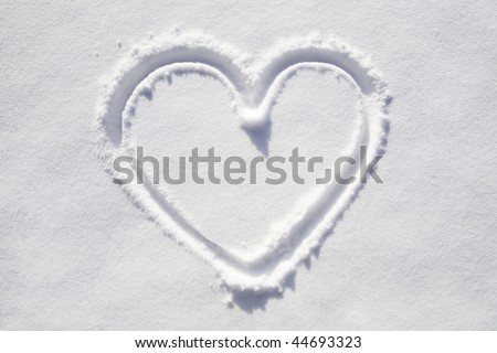 The symbol of the heart, painted on the fresh white snow