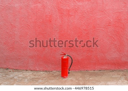 Fire Extinguisher with Pastel Red Wall