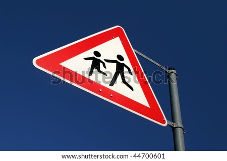 Warning sign of playing childs near a school