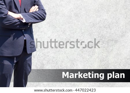 Man in suit on a concrete wall background.Business man success or soft Business man success in he working on marketing online or e learning with global learning on over blurred old cement wall. 