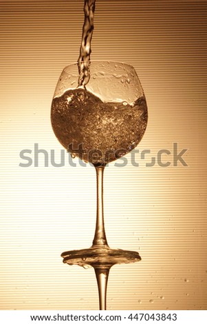 Water splashing in a wineglass