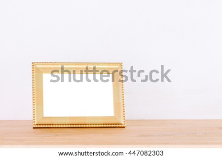Photo frame on wooden table