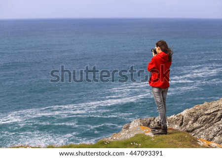 Photographer girl on sea background