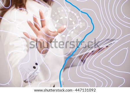 Geographic information systems concept, woman scientist working with futuristic GIS interface on a transparent screen. Royalty-Free Stock Photo #447131092