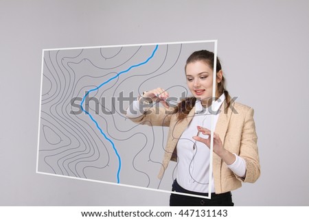 Geographic information systems concept, woman scientist working with futuristic GIS interface on a transparent screen. Royalty-Free Stock Photo #447131143