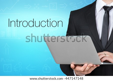 Unrecognizable businessman with laptop standing near text - introducion