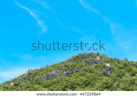 Green mountain and clear blue sky background