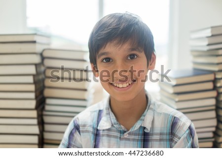 Kid with a lot of books