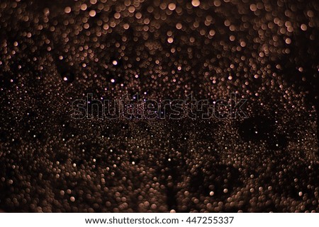 Colourful abstract bokeh on a black background design 