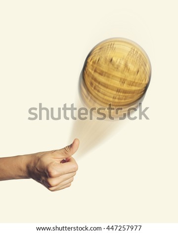 Person hand throwing up a coin to make a decision isolated on toned background
