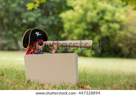 Boy pretending to be a pirate in park