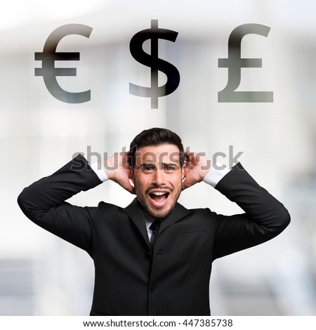 Desperate businessman in front of Euro, Dollar and Pound signs