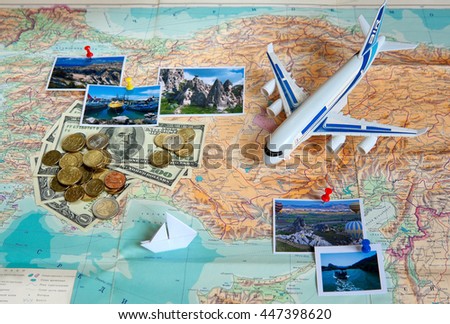 Travel concept plan and prepare for the trip to Turkey. Money, plane, pictures on the map with the background of the Russian language (Selective focus).