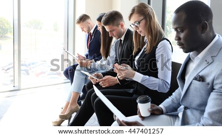 Business people waiting for job interview Royalty-Free Stock Photo #447401257