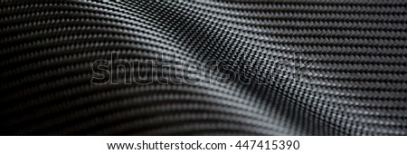 Carbon fiber composite raw material background Royalty-Free Stock Photo #447415390