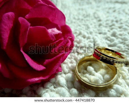Wedding rings with pink roses. Elegance and tradition.
