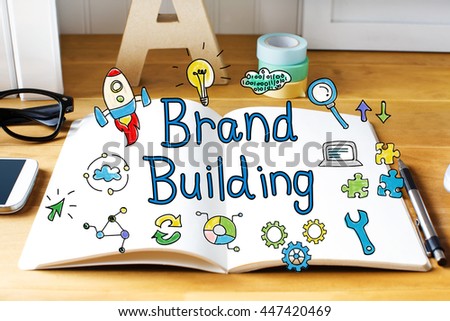 Brand Building concept with notebook on wooden desk 
