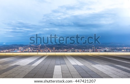 cityscape and skyline of portland in cloud sky at twilight on view from empty floor