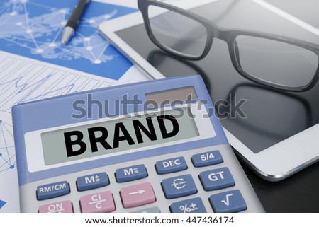 BRAND Calculator  on table with Office Supplies. ipad