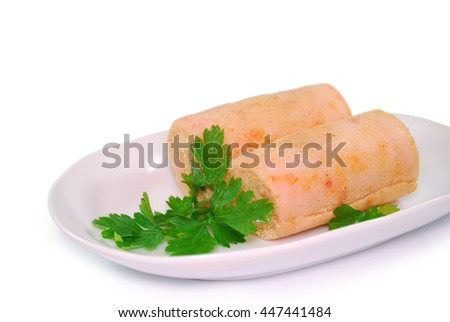 rolled lard bacon pork with hot pepper and spices isolated on a white background. Traditional ukrainian snack to vodka.