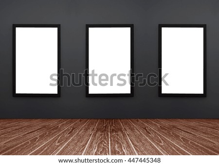 three Black frame hanging on a grey wall, white isolate, included clipping path in a frame , perspective red brown wooden floor, for advertiser, graphic editor