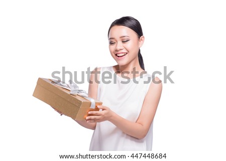 Young woman happy smile hold gift box in hands, isolated over white background.